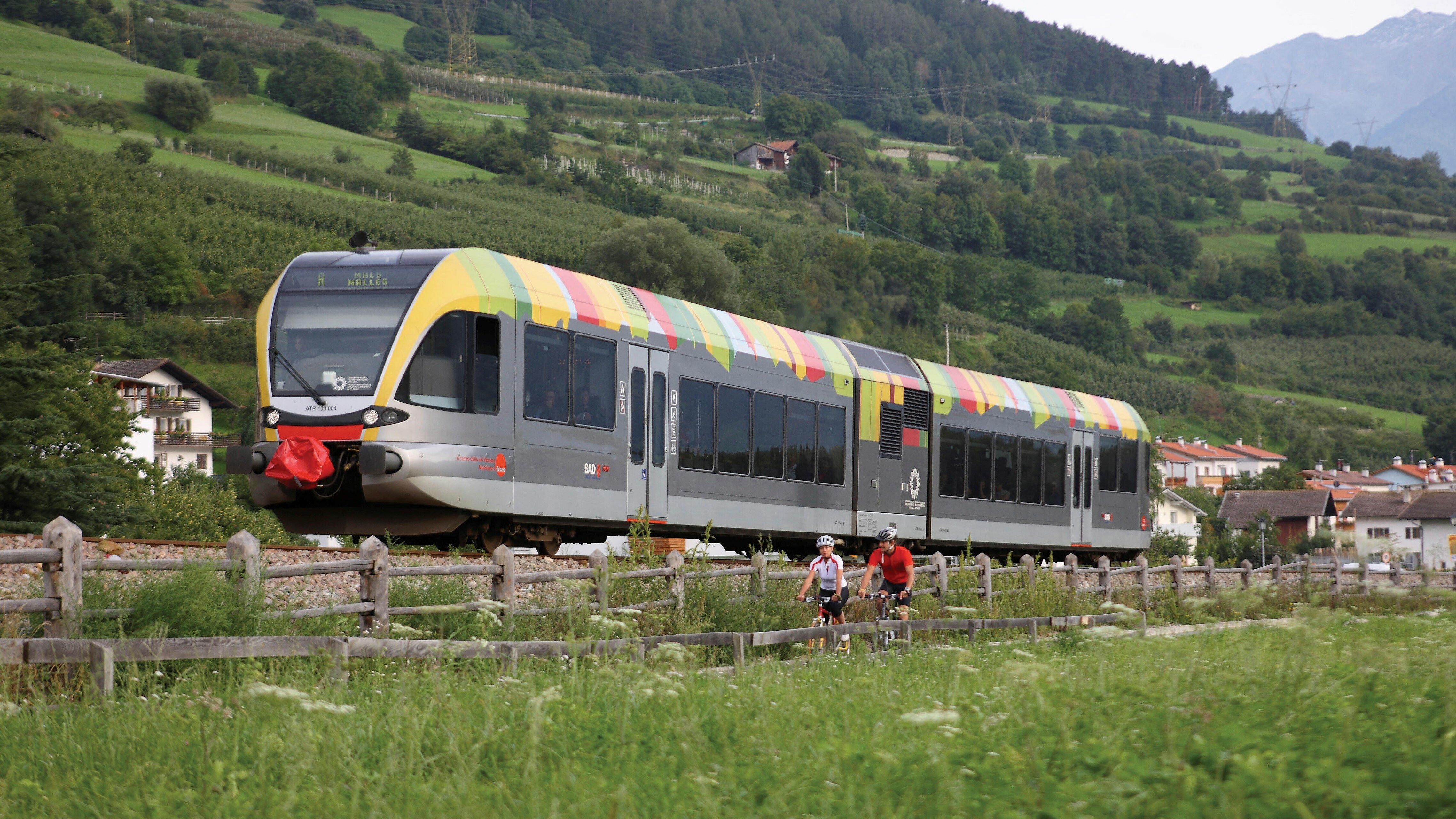 The Val Venosta valley/ Vinschgau railway an two bikers